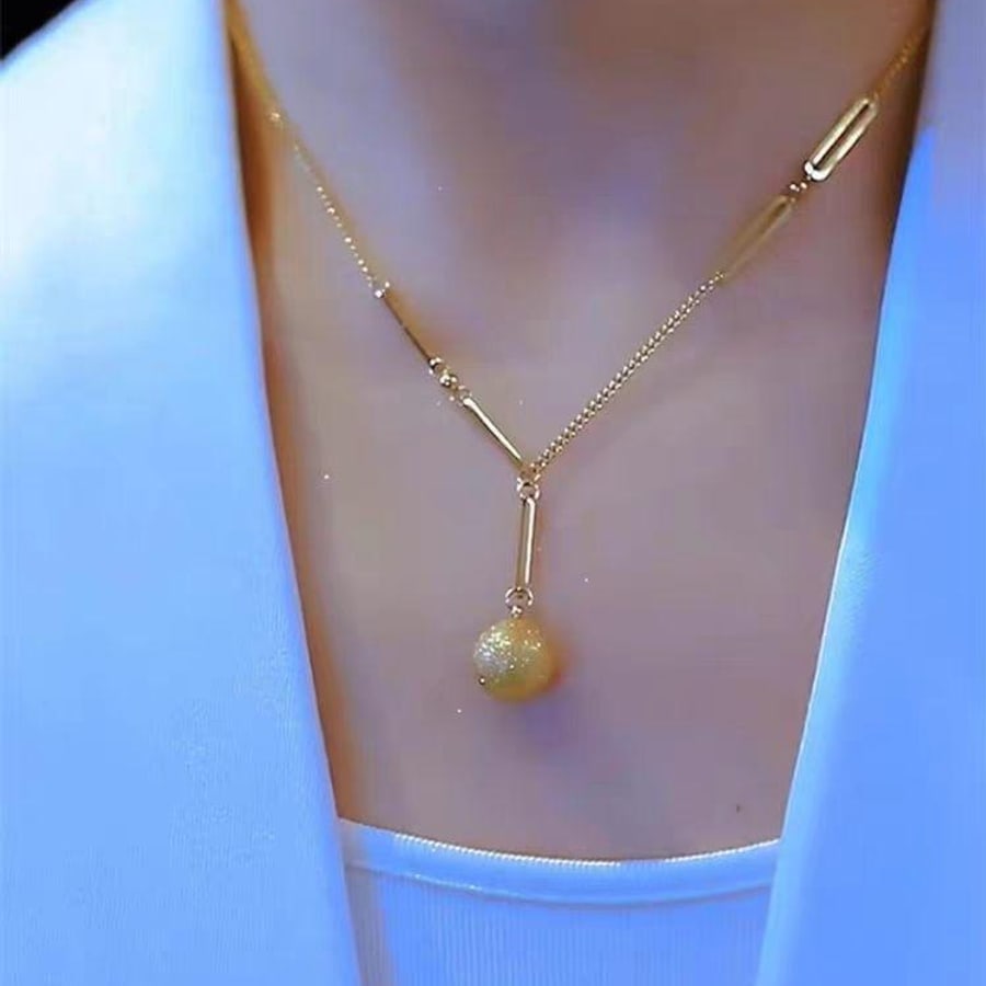 Cadena dorada con perla colgante